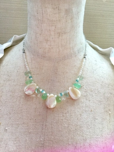 Women's necklace made of natural shell and green chalcedony stones 