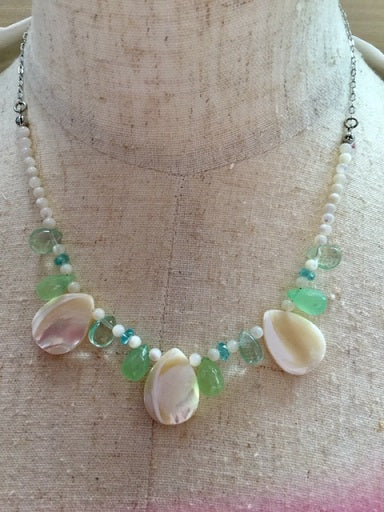 Women's necklace made of natural shell and green chalcedony stones 